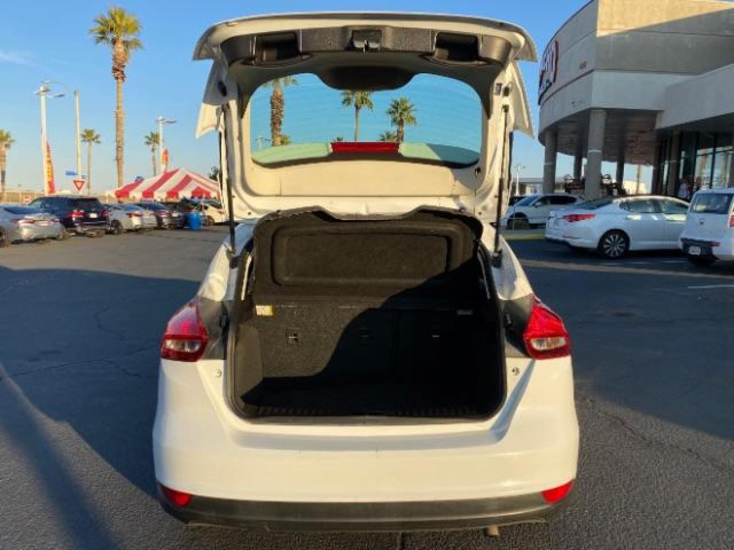 2016 WHITE Ford Focus (1FADP3K25GL) with an 4-Cyl Flex Fuel 2.0L engine, Manual 5-Spd transmission, located at 412 Auto Vista Drive, Palmdale, CA, 93551, (661) 945-0620, 34.592636, -118.136681 - Photo#13