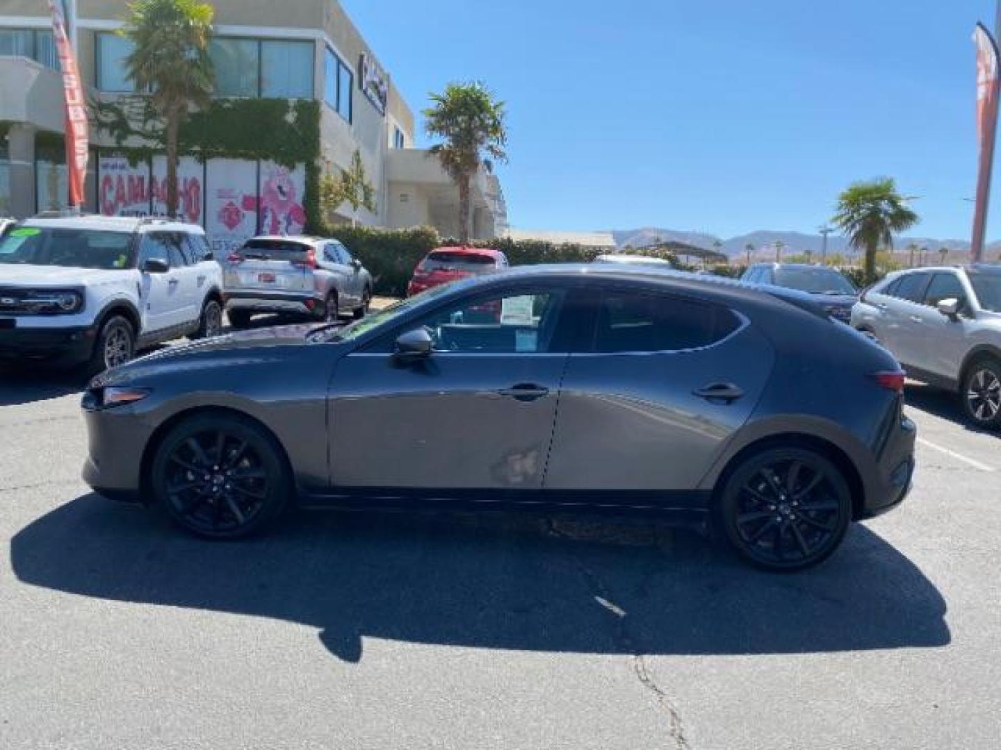 2021 GRAY Mazda Mazda3 Hatchback (JM1BPBML2M1) with an 4-Cyl SKYACTIV-G 2.5 Liter engine, Automatic 6-Spd SKYACTIV-Drive w/Manual transmission, located at 412 Auto Vista Drive, Palmdale, CA, 93551, (661) 945-0620, 34.592636, -118.136681 - Photo#3