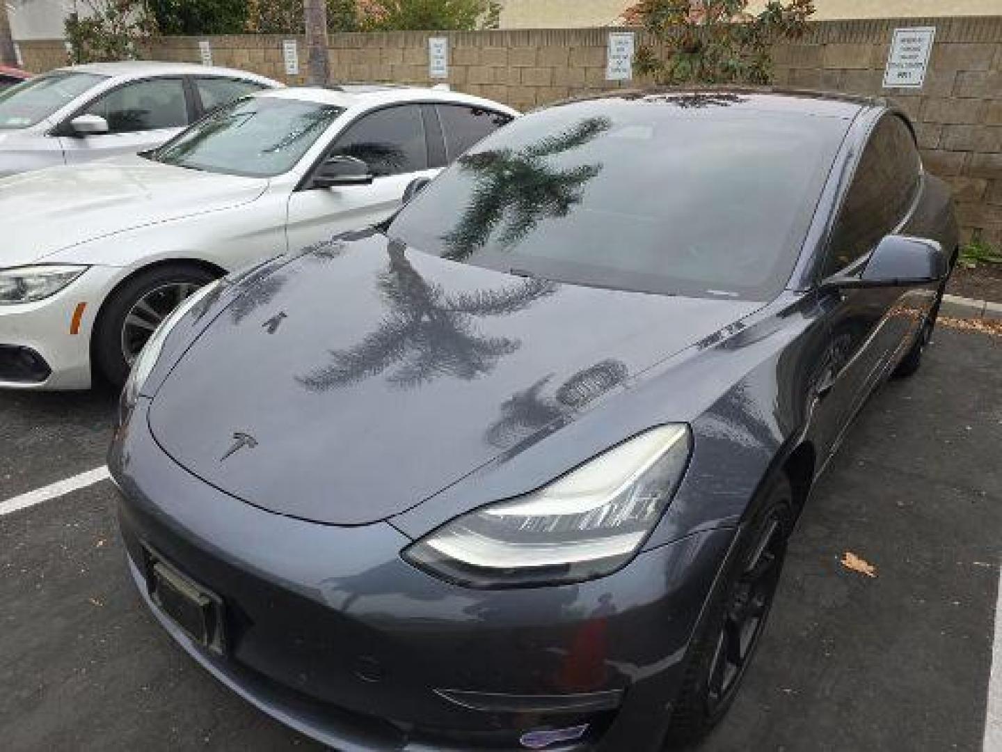 2019 GRAY Tesla Model 3 (5YJ3E1EA8KF) with an AC Electric Motor engine, Single-Speed Fixed Gear transmission, located at 412 Auto Vista Drive, Palmdale, CA, 93551, (661) 945-0620, 34.592636, -118.136681 - Photo#0